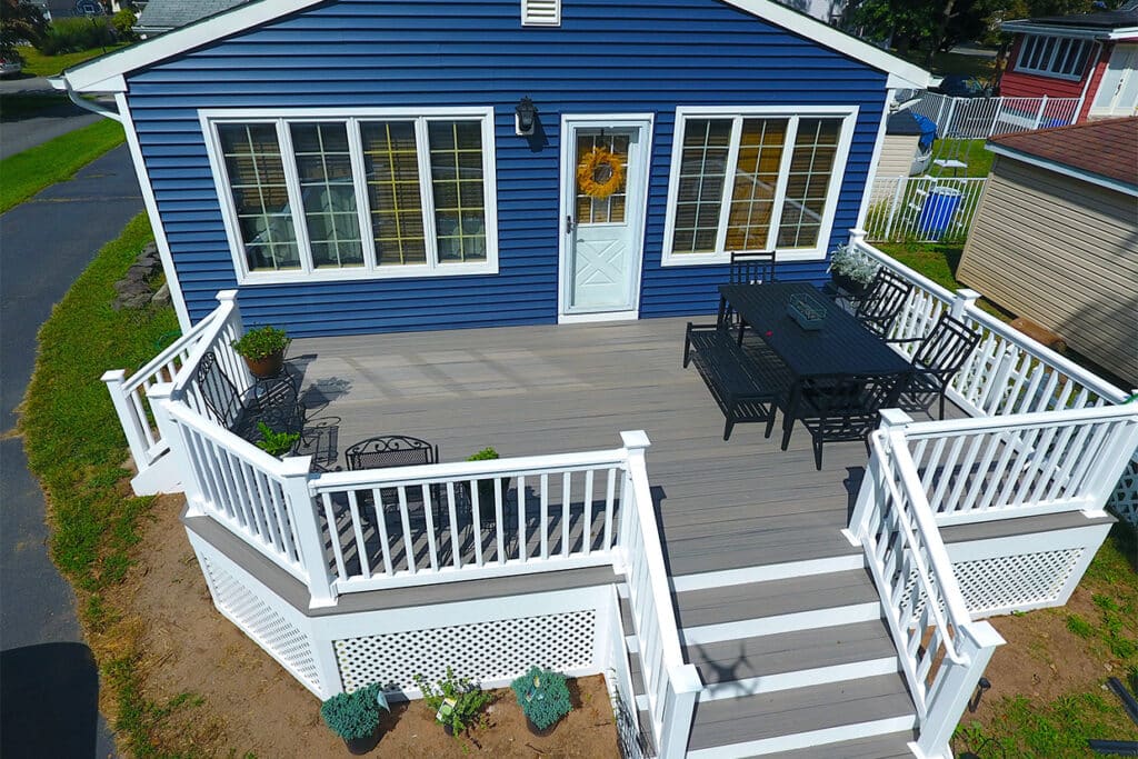 20'X16' Deck Resurface, Changed The Old Wood Deck To New Trex Decking Color Rocky Harbor And White Vinyl Railings.