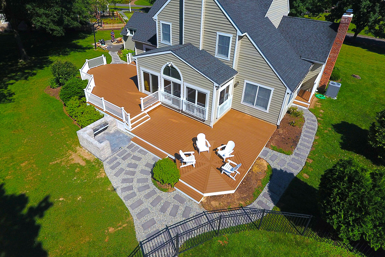 Aerial View Showing Modern Deck Landscaping Ideas With Garden Paths, Spacious Seating, And Lush Greenery.