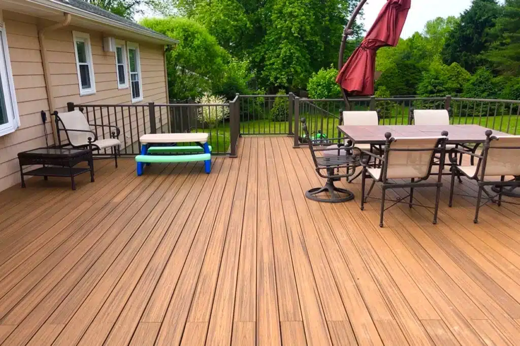 A Well-Designed Outdoor Deck Featuring Durable Patio Flooring, Ideal For Family Gatherings And Relaxation.