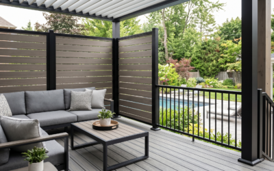 Modern Deck Privacy Wall Featuring Horizontal Gray Composite Panels Integrated With Black Metal Railings Next To An Outdoor Lounge Sofa.